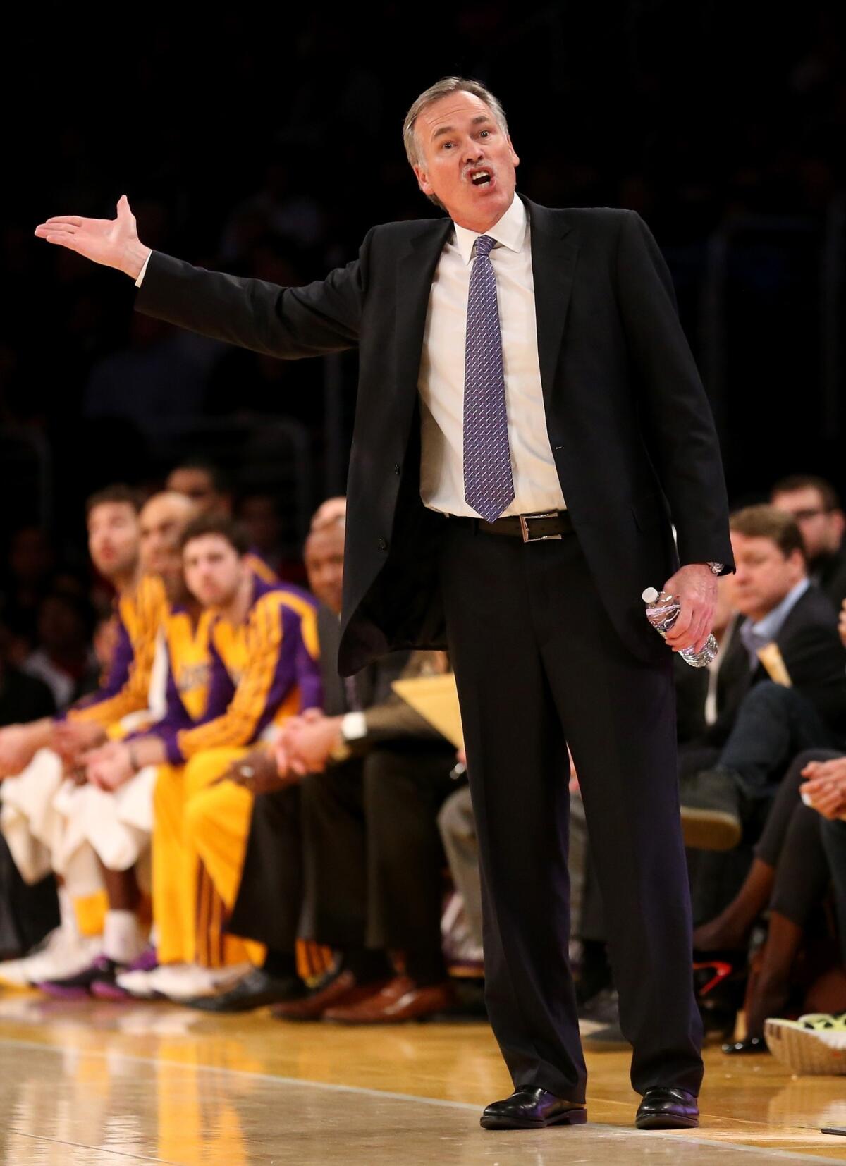 Lakers Coach Mike D'Antoni argues with a referee during a 114-108 loss to the Phoenix Suns on Tuesday.