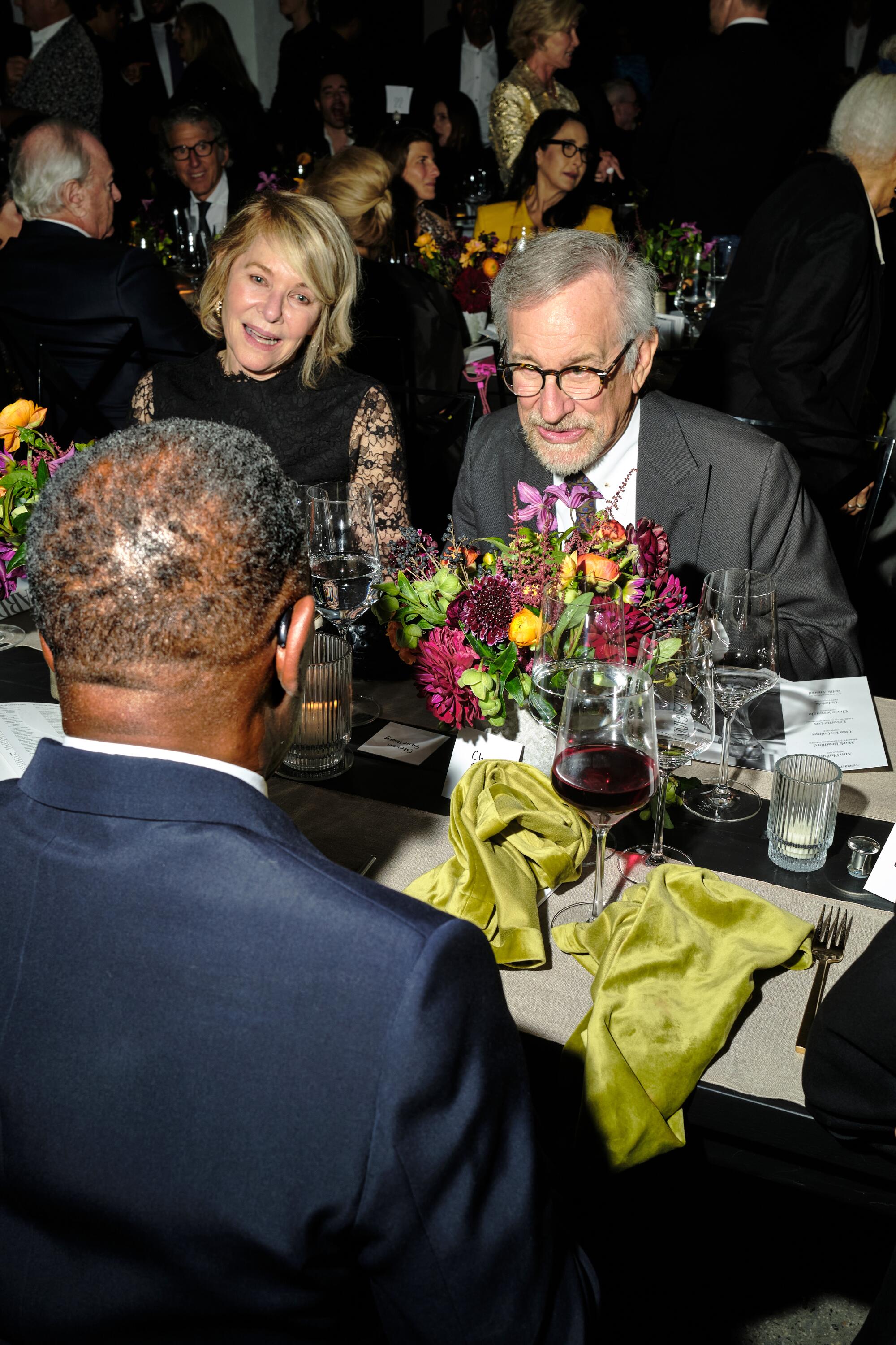Kate Capshaw and Steven Spielberg seated for dinner at the Hammer gala.
