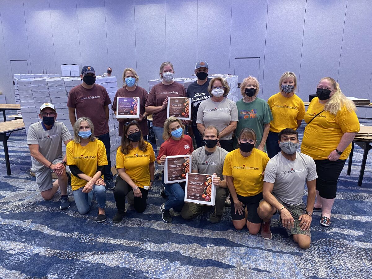 Volunteers for Mama's Kitchen assembled pie boxes Nov. 13 in La Jolla for the nonprofit's annual Thanksgiving pie sale.
