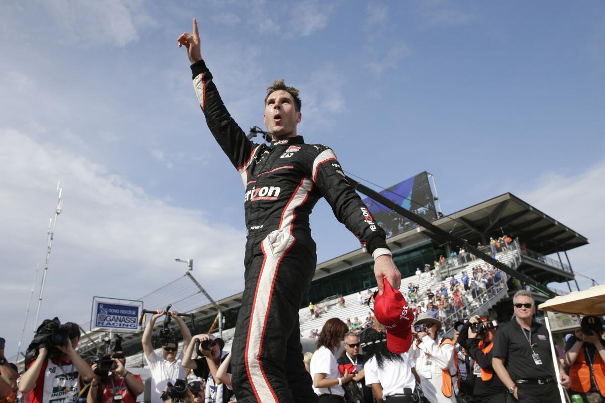 IndyCar driver Will Power celebrates after winning the Grand Prix of Indianapolis on Saturday.