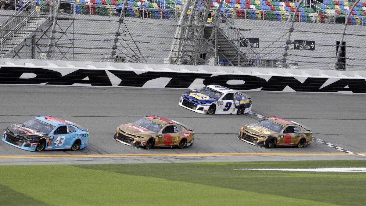 NASCAR drivers Darrell Wallace Jr. (43), Austin Dillon (3), Daniel Hemric (8) and Chase Elliott (9) move through the front stretch during a practice session at Daytona International Speedway on Friday.