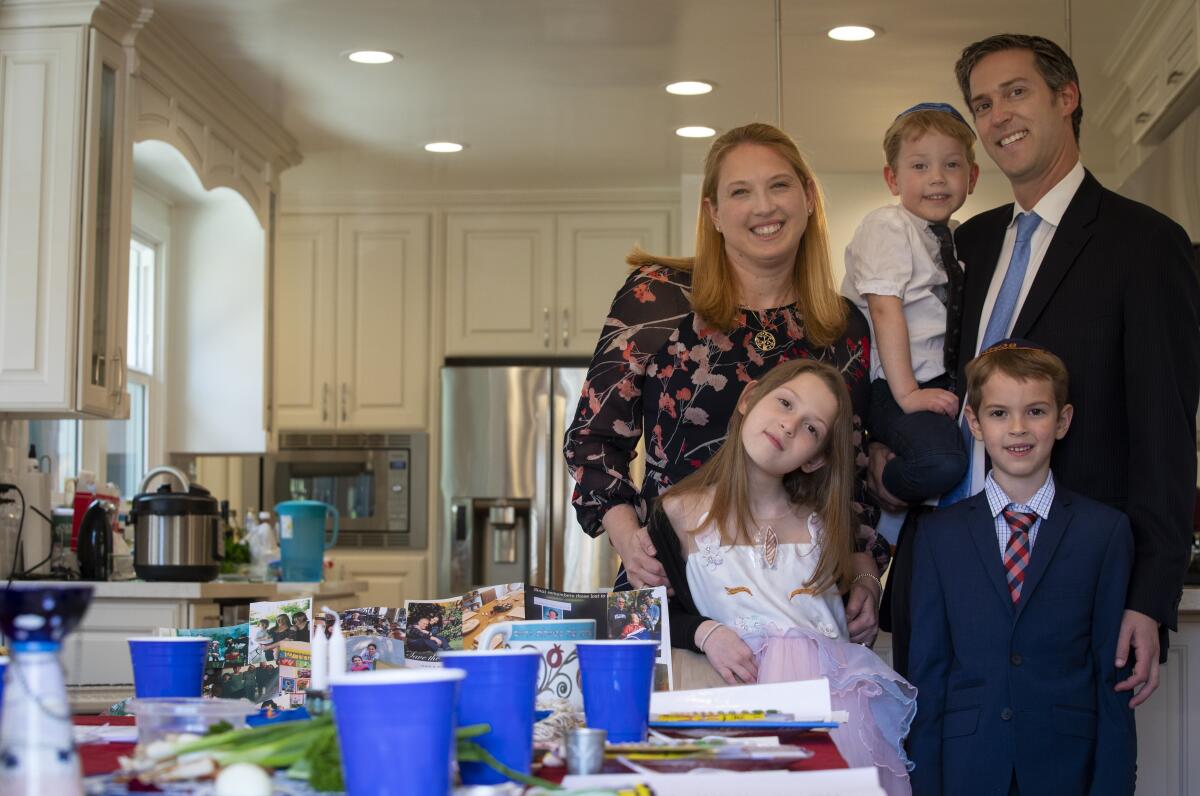 Rabbi Nicole Guzik, her daughter, Annie Sherman, 8, son Henry Sherman, 4, middle, son Zachary Sherman, 6, and husband Rabbi Erez Sherman will be hosting a virtual seder for their community on the first night of Passover.