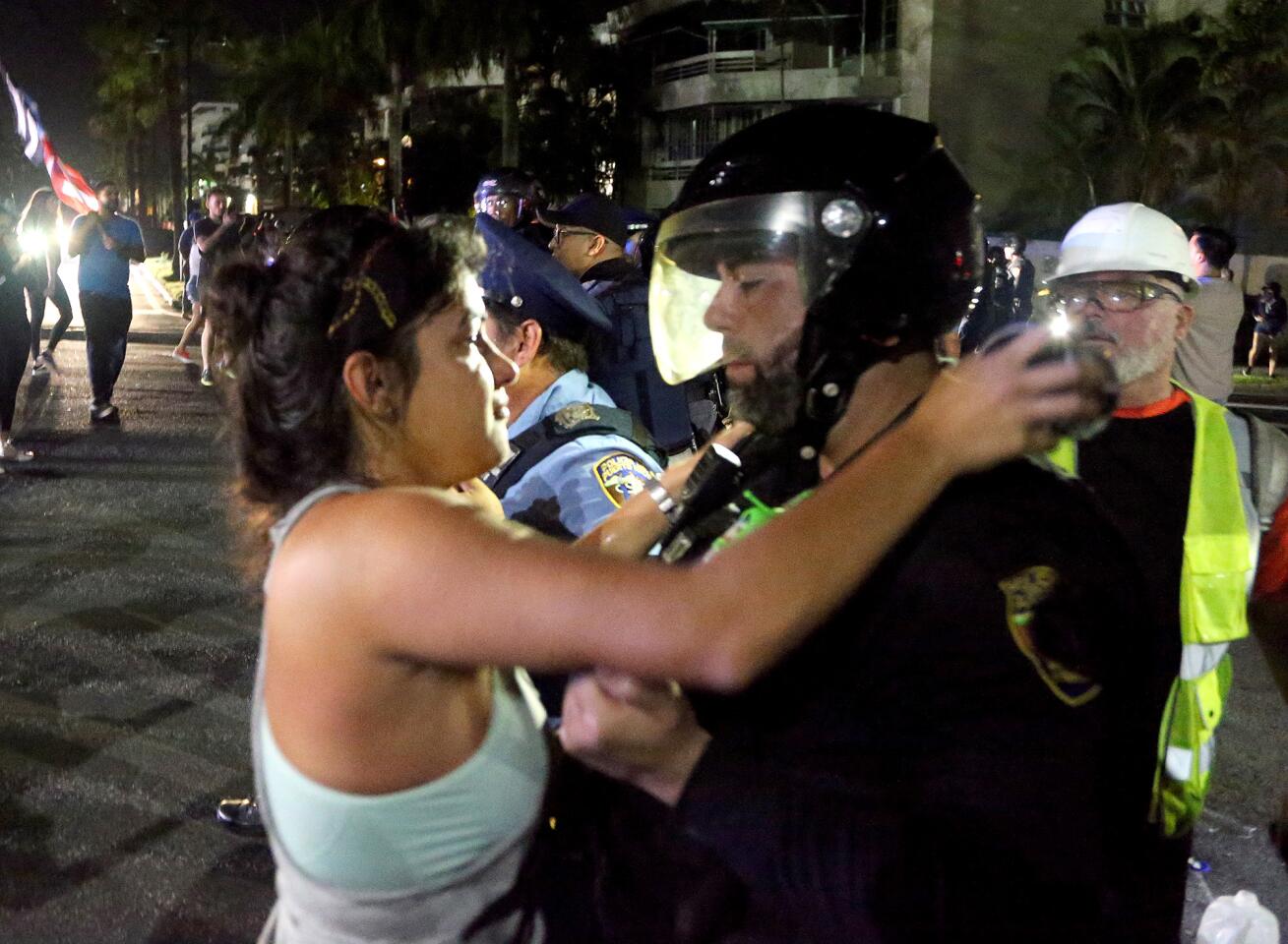 Protester hugs a police officer
