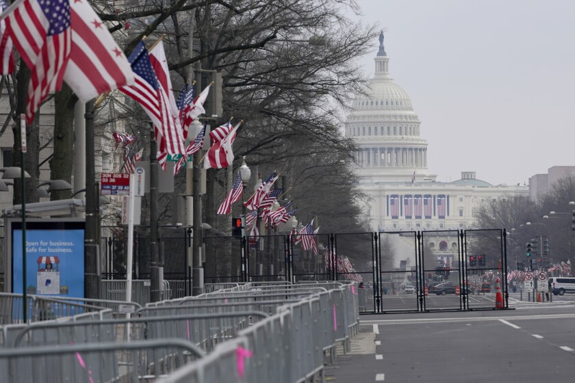 A view down Pennsylvania Avenue shows the security around the Capitol Hill in Washington, Friday, Jan. 15, 2021, ahead of the inauguration of President-elect Joe Biden and Vice President-elect Kamala Harris. Between the still-raging pandemic and suddenly very real threat of violence from supporters of outgoing President Donald Trump, Jan. 20 promises to be one of the most unusual presidential inaugurations in American history. Joe Biden and Kamala Harris will take the oath of office outside the Capitol. (AP Photo/Susan Walsh)