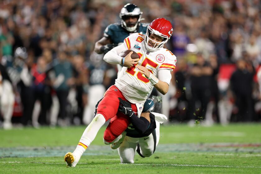 GLENDALE, ARIZONA - FEBRUARY 12: Patrick Mahomes #15 of the Kansas City Chiefs is tackled by C.J. Gardner-Johnson #23 of the Philadelphia Eagles during the fourth quarter in Super Bowl LVII at State Farm Stadium on February 12, 2023 in Glendale, Arizona. (Photo by Christian Petersen/Getty Images)