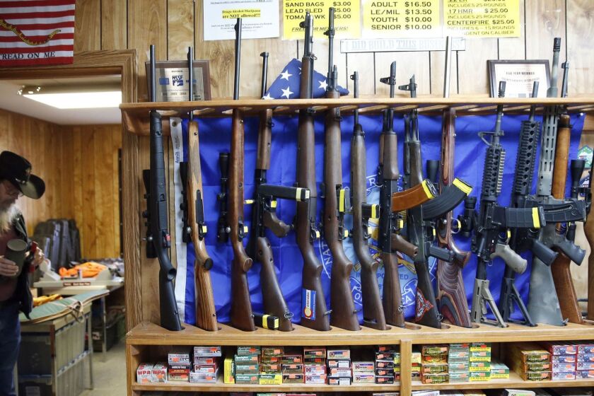 In this March 15, 2016 photo, guns for rent are on display at a shooting range and retail store in Cherry Creek, Colo. . Across the U.S., suicides account for nearly two-thirds of all gun deaths, with 21,334 gun deaths by suicide in 2014, according to federal data. (AP Photo/Brennan Linsley)