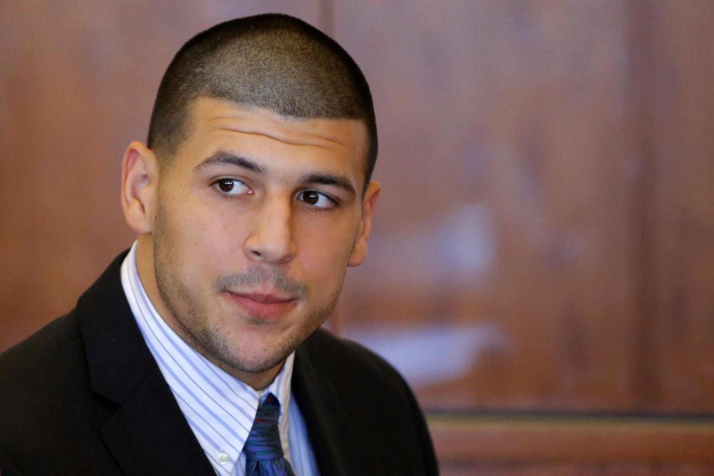 Aaron Hernandez, former player for the NFL's New England Patriots football team, attends a pre-trial hearing at the Bristol County Superior Court in Fall River, Massachusetts October 9, 2013, in connection with the death of semi-pro football player Odin Lloyd in June. Hernandez, who was a rising star in the NFL before his arrest and release by the Patriots, has pleaded not guilty.