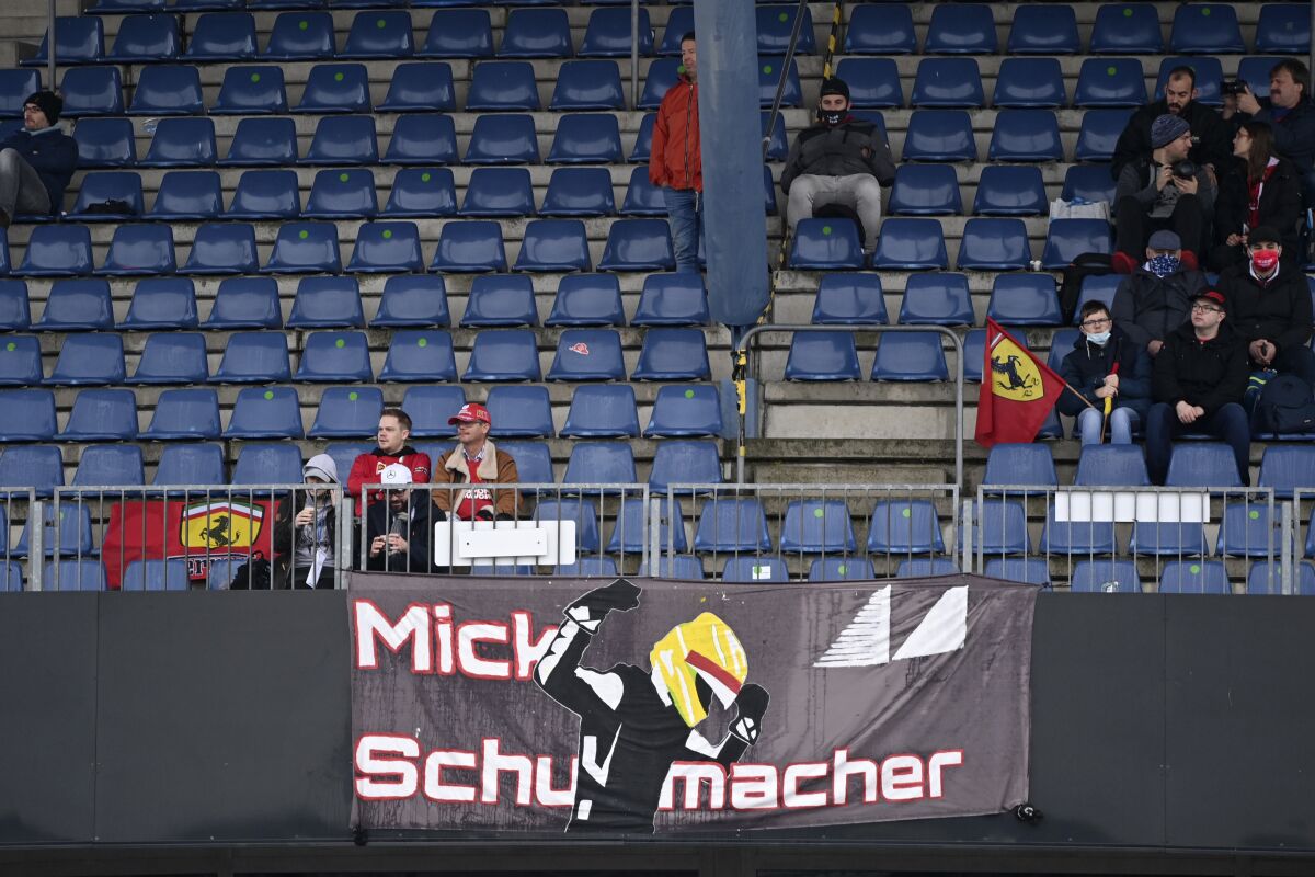 A banner hangs from the stands supporting German driver Mick Schumacher of the Ferrari Driver Academy who will be testing an Alfa Romeo car during the first practice session for the Eifel Formula One Grand Prix at the Nuerburgring racetrack in Nuerburg, Germany, Friday, Oct. 9, 2020. The Germany F1 Grand Prix will be held on Sunday. (Ina Fassbender, Pool via AP)