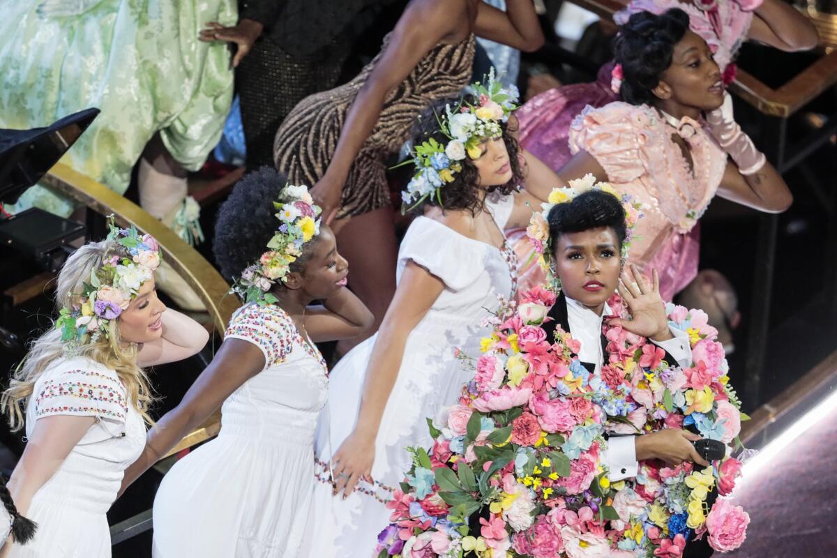 Janelle Monáe opens the Oscars with, among so much else, dancers in "Midsommar" cosutumes.