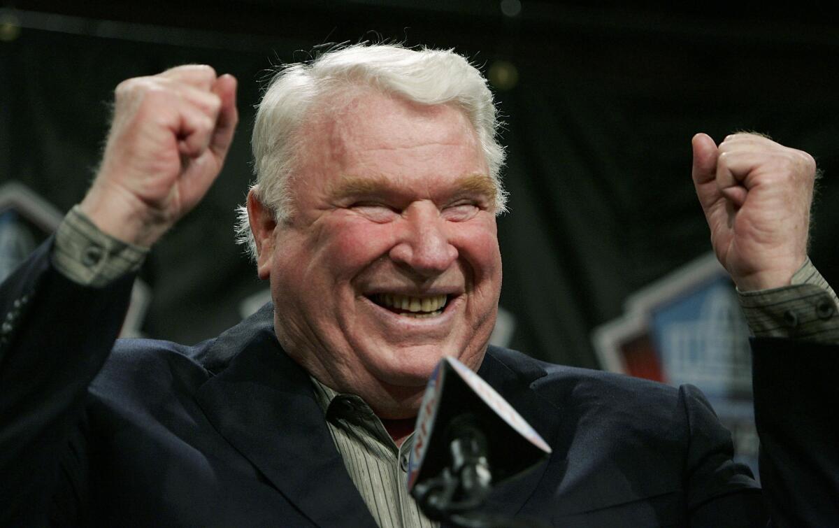 NFL legend and broadcaster John Madden celebrates his selection to the NFL Hall of Fame.