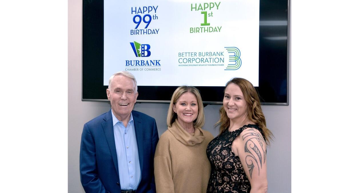 Chamber of Commerce staff members Tom Flavin, from left, Chris Hunter and Christina Ellixson welcomed over 100 members and guests to last week's reorganization ceremony.