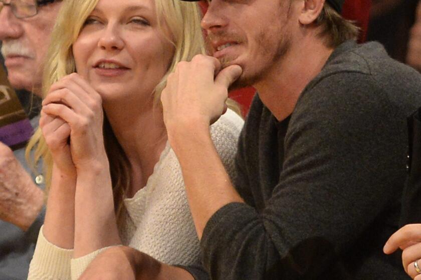 Kirsten Dunst is seen at a Lakers game with actor Garrett Hedlund at Staples Center.