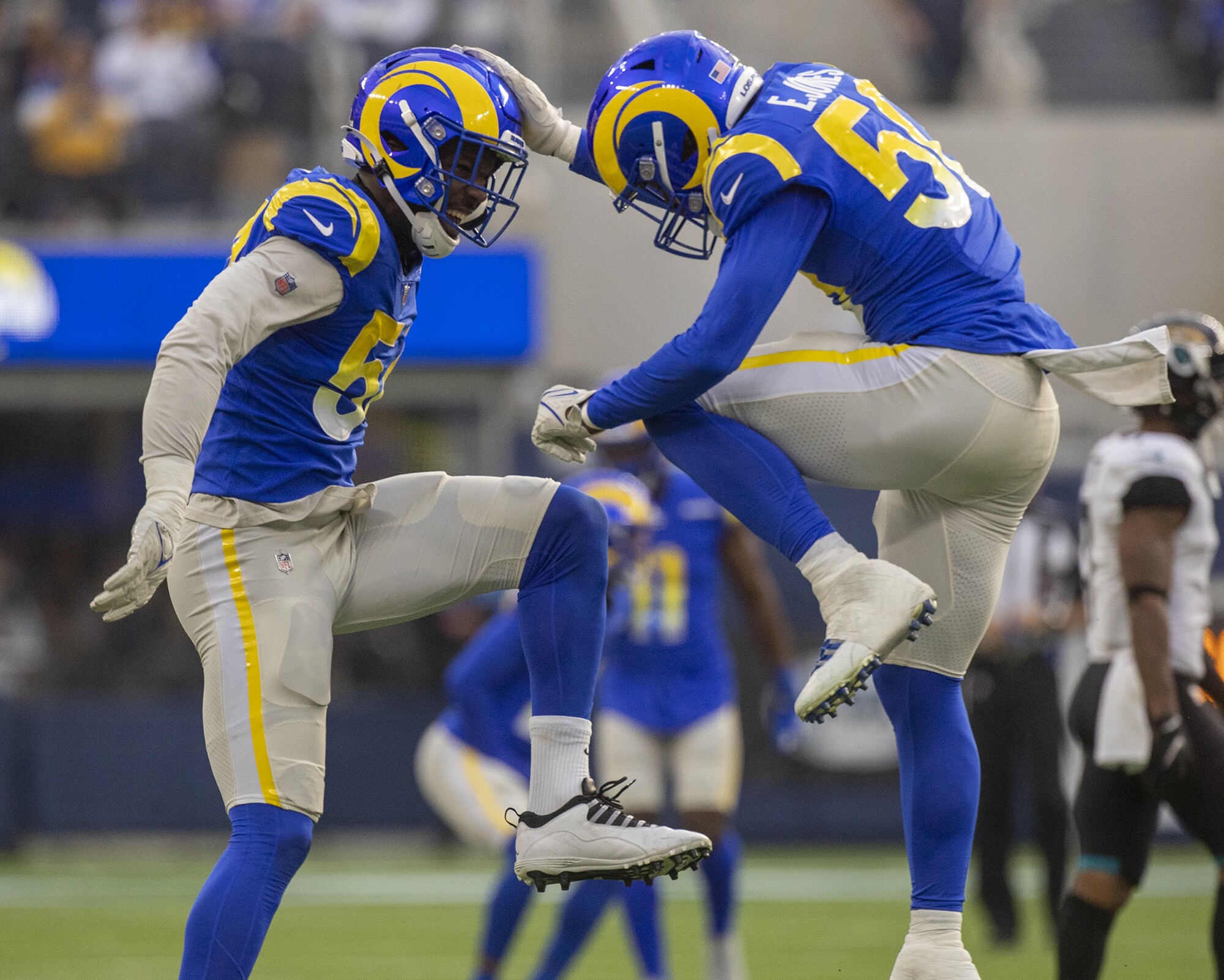 Rams linebackers Leonard Floyd and Ernest Jones celebrate after sacking Jaguars quarterback Trevor Lawrence.