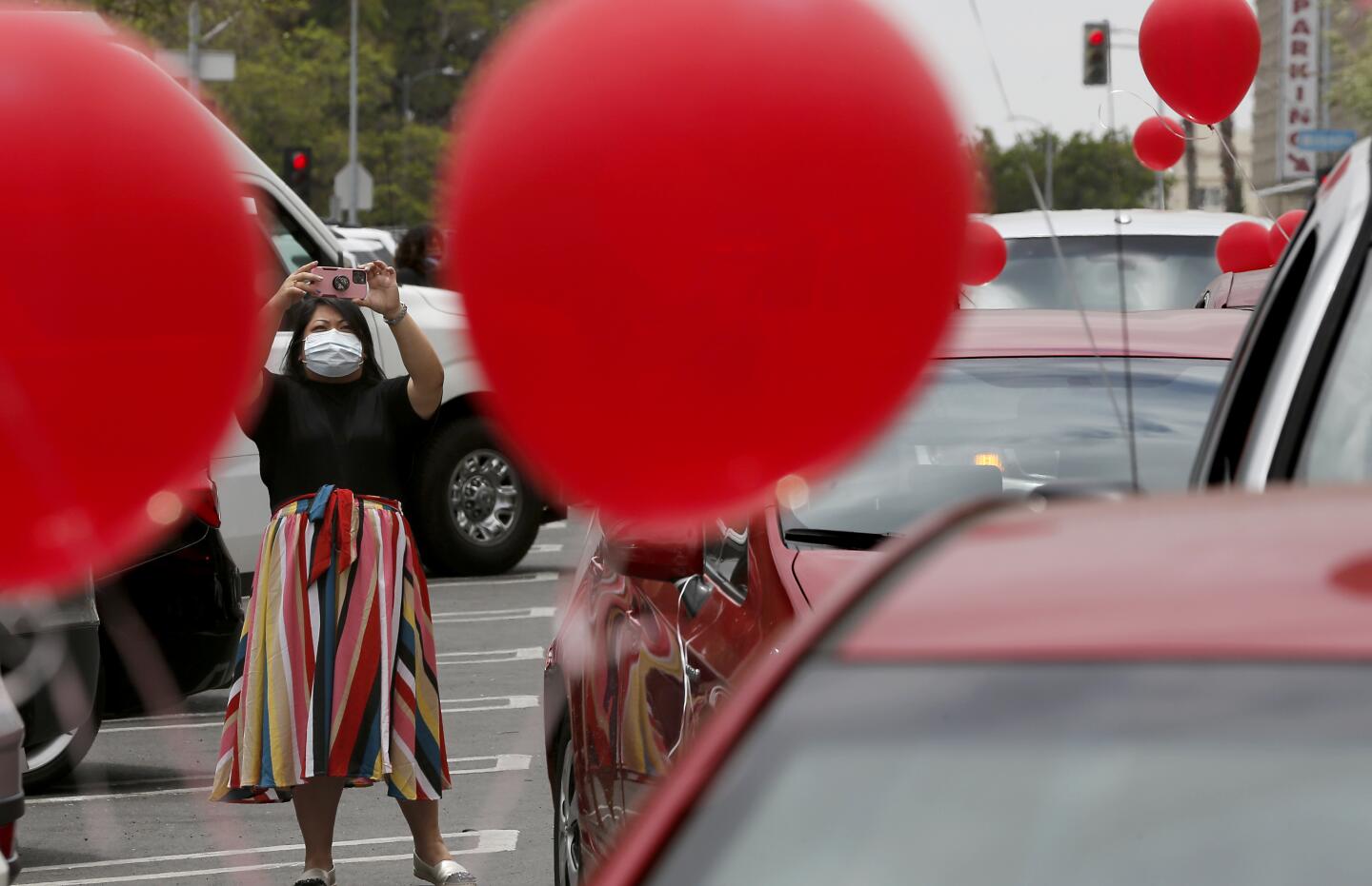 A celebratory car caravan around MacArthur Park in Los Angeles.