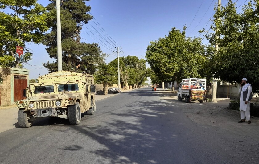An Afghan army Humvee patrols in Kunduz city, north of Kabul, in Afghanistan.