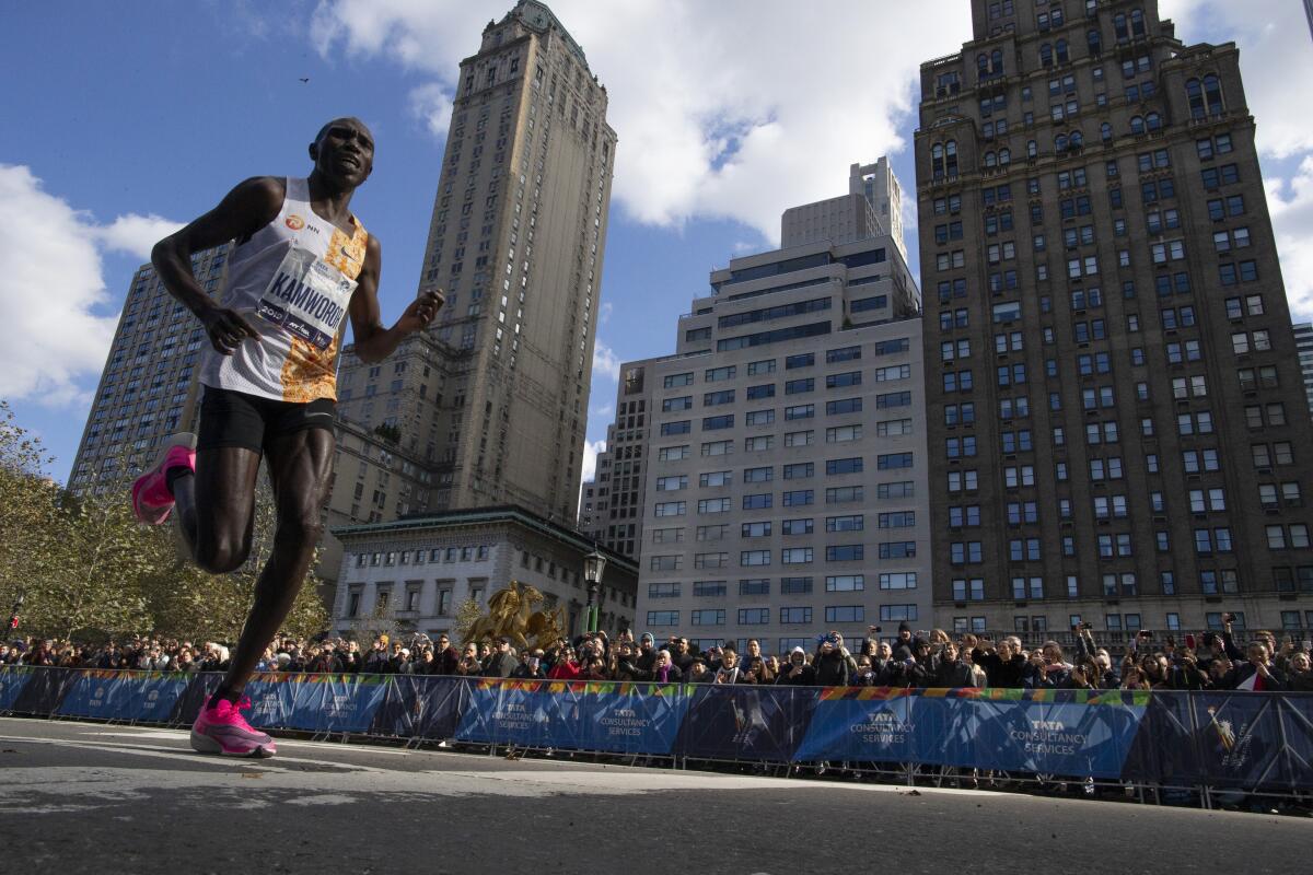 Kenya's Geoffrey Kamworor leads the professional men's division during the New York City Marathon on Nov. 3.