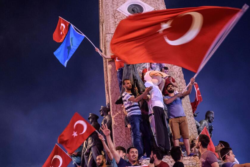 Supporters of Turkish President Recep Tayyip Erdogan hold an effigy of Fethullah Gulen during a rally at Taksim Square in Istanbul in July. They blamed the coup on Gulen's followers.