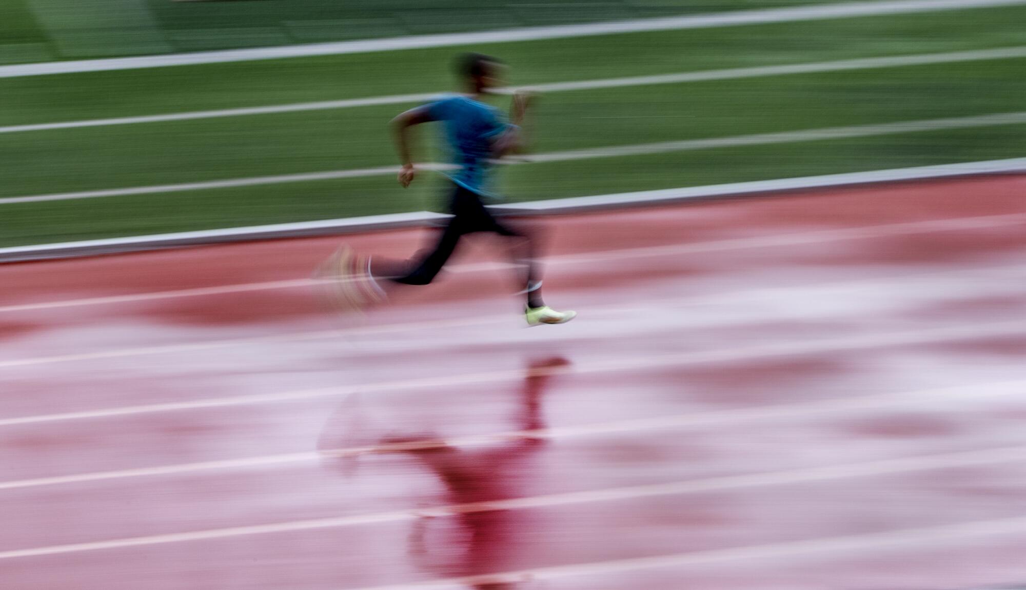 A runner on a wet track.