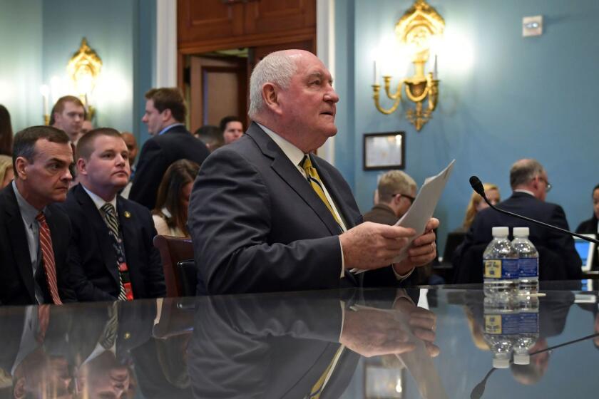 Agriculture Secretary Sonny Perdue sits down to testify on Capitol Hill in Washington, Tuesday, Feb. 6, 2018, during a hearing on the rural economy. (AP Photo/Susan Walsh)