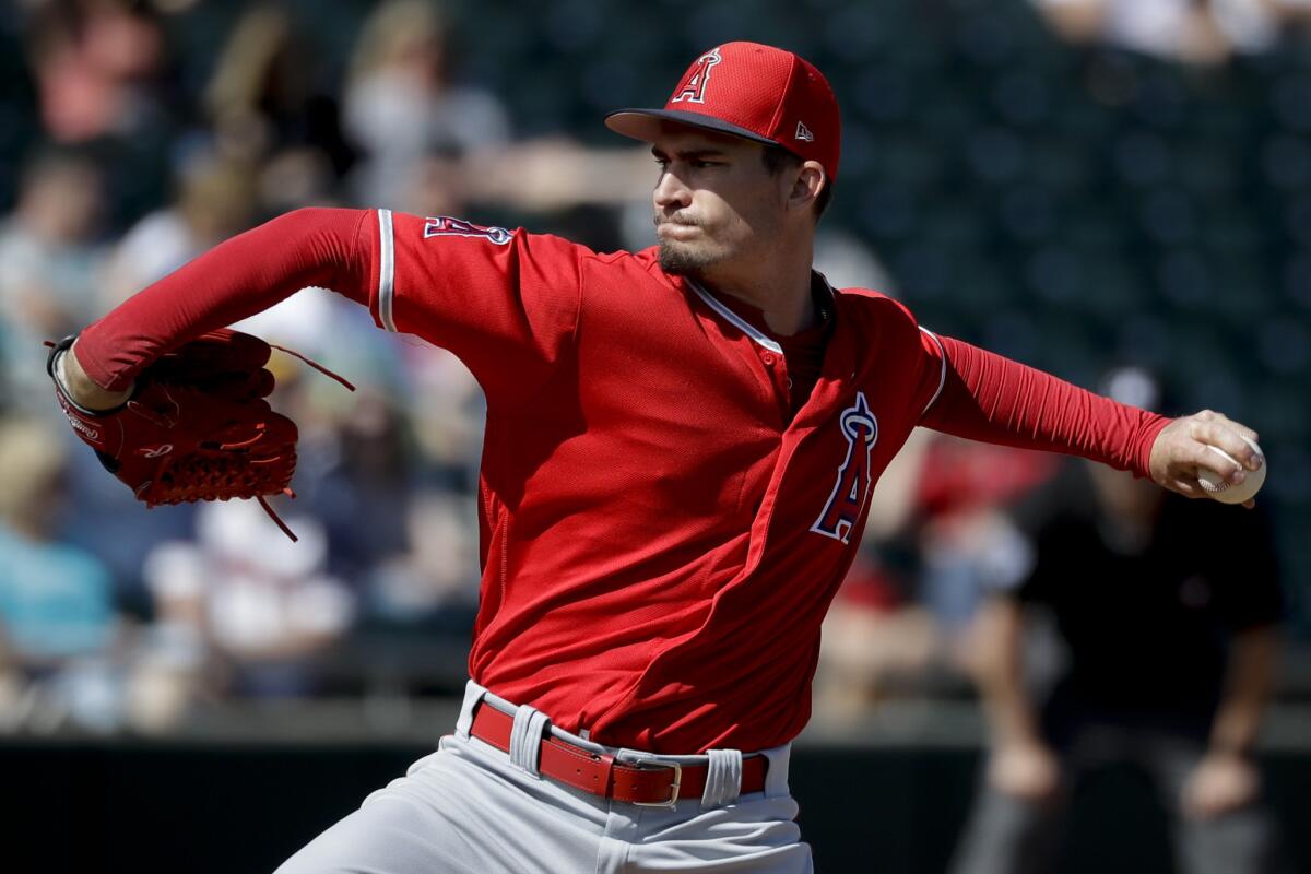 Angels starting pitcher Andrew Heaney throws against the Oakland Athletics during the first inning of a spring baseball game in Mesa, Ariz. on Feb. 26.