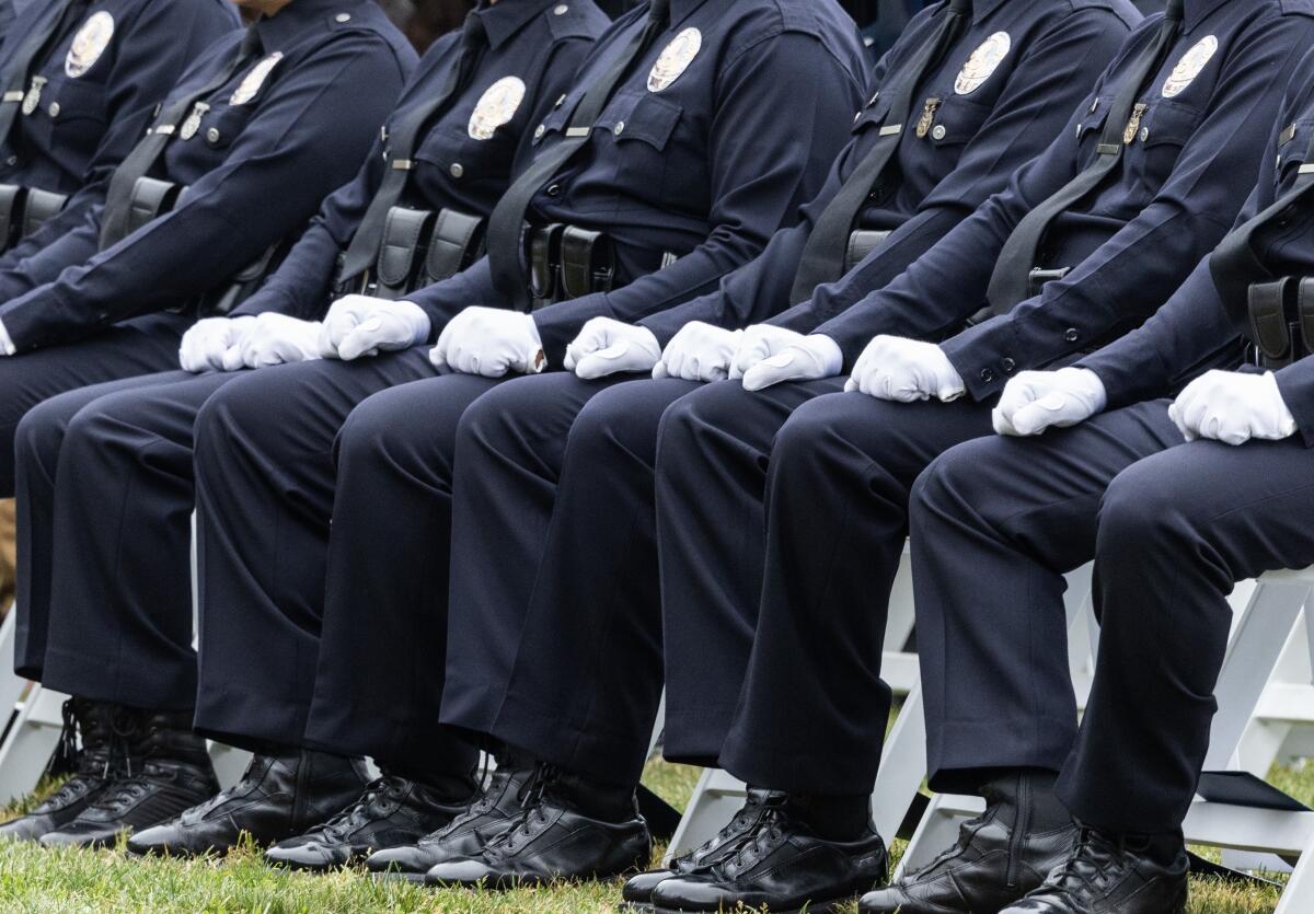 A row of seated LAPD recruits.