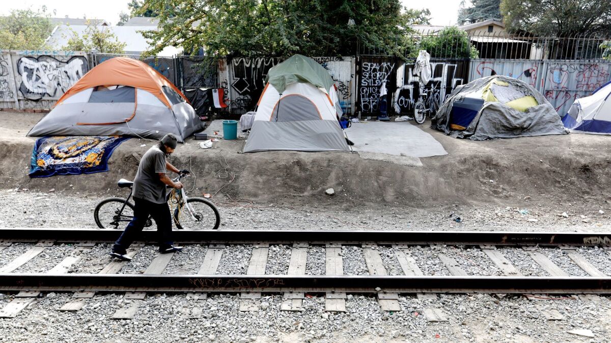 Raul Rodriguez, without a residence for more than five years, lives at a homeless camp along West 117th Street and South Figueroa Street in Los Angeles.