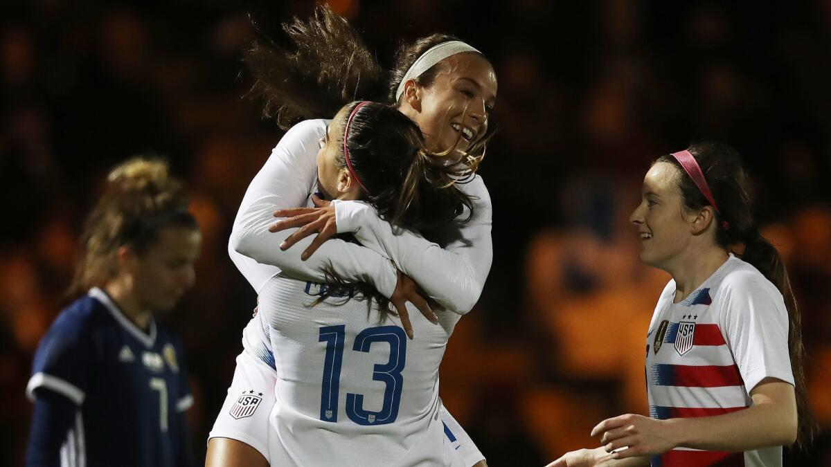 Mallory Pugh of United States congratulates teammate Alex Morgan after she scores the opening goal during the match between Scotland and United States.