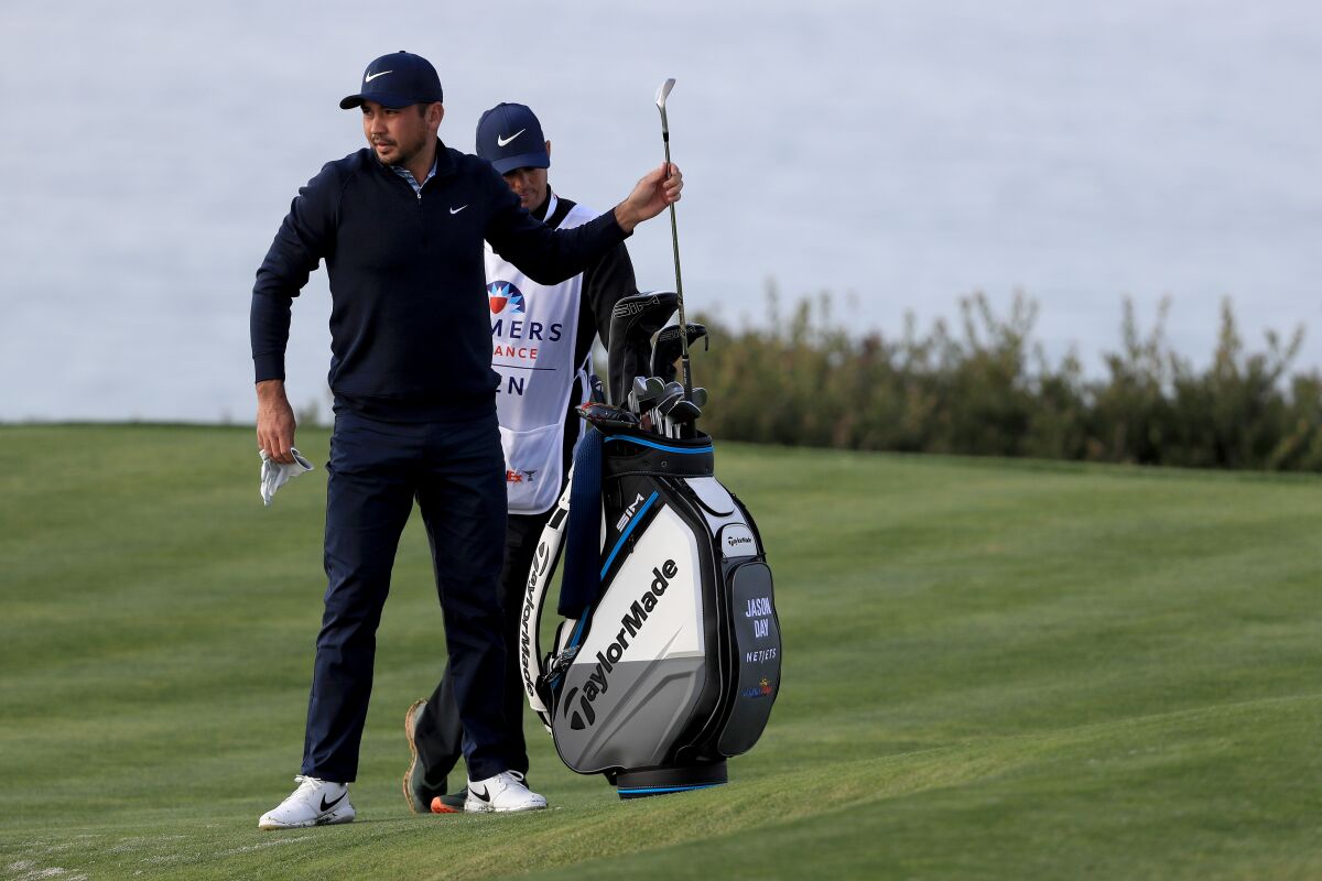 Jason Day draws a club during the pro-am tournament at the Farmers Insurance Open in San Diego on Wednesday.