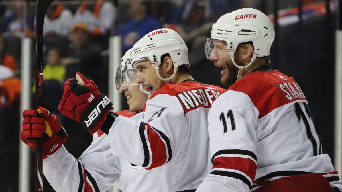 Carolina Hurricanes forward Nino Niederreiter, center, celebrates with teammates after scoring a goal against the New York Islanders in Game 2 of the NHL Eastern Conference semifinals.