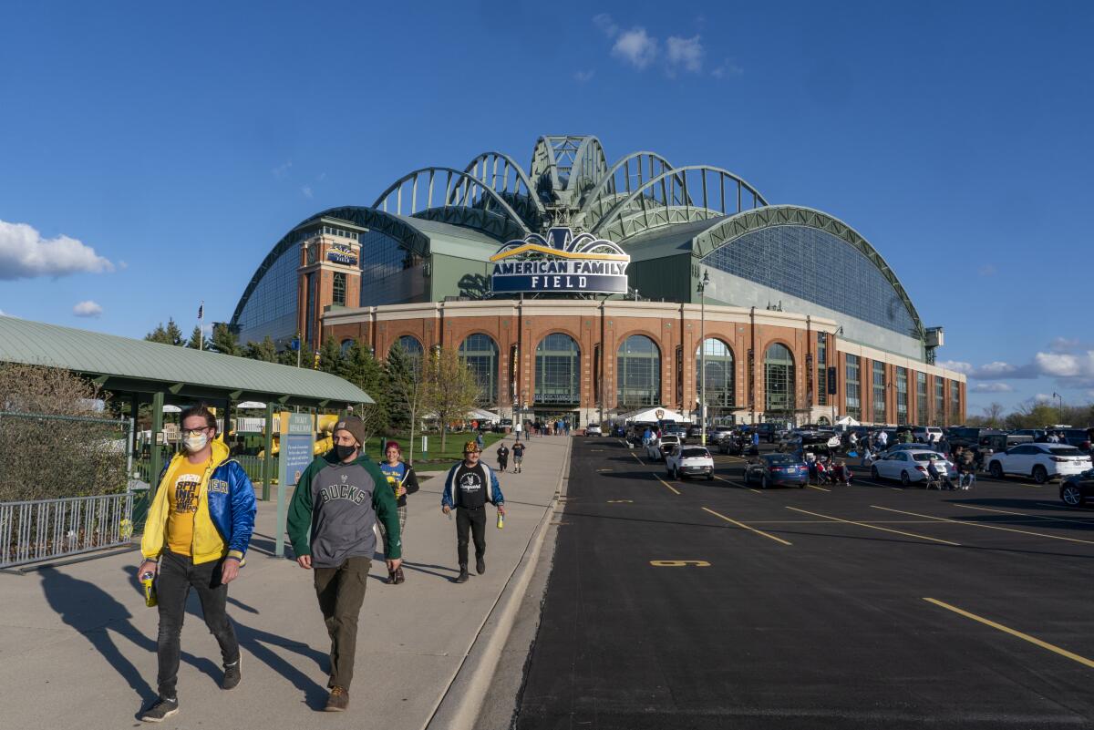 Fans outside American Family Field before a game between the Milwaukee Brewers and the Chicago Cubs.