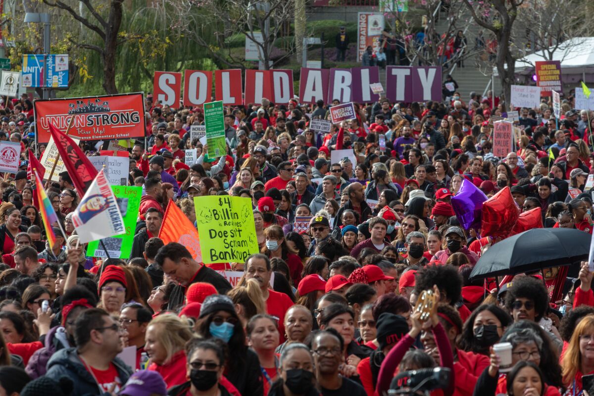 LAUSD strike that is closing schools blindsides parents 2 Huge crowd gather at a downtown park, many in red shirts.