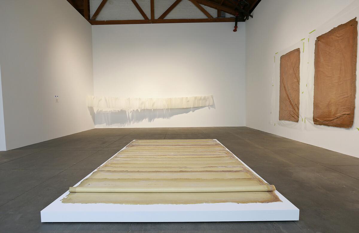 In the foreground: Latex on canvas pieces by Eva Hesse on view at Hauser Wirth & Schimmel in Los Angeles.