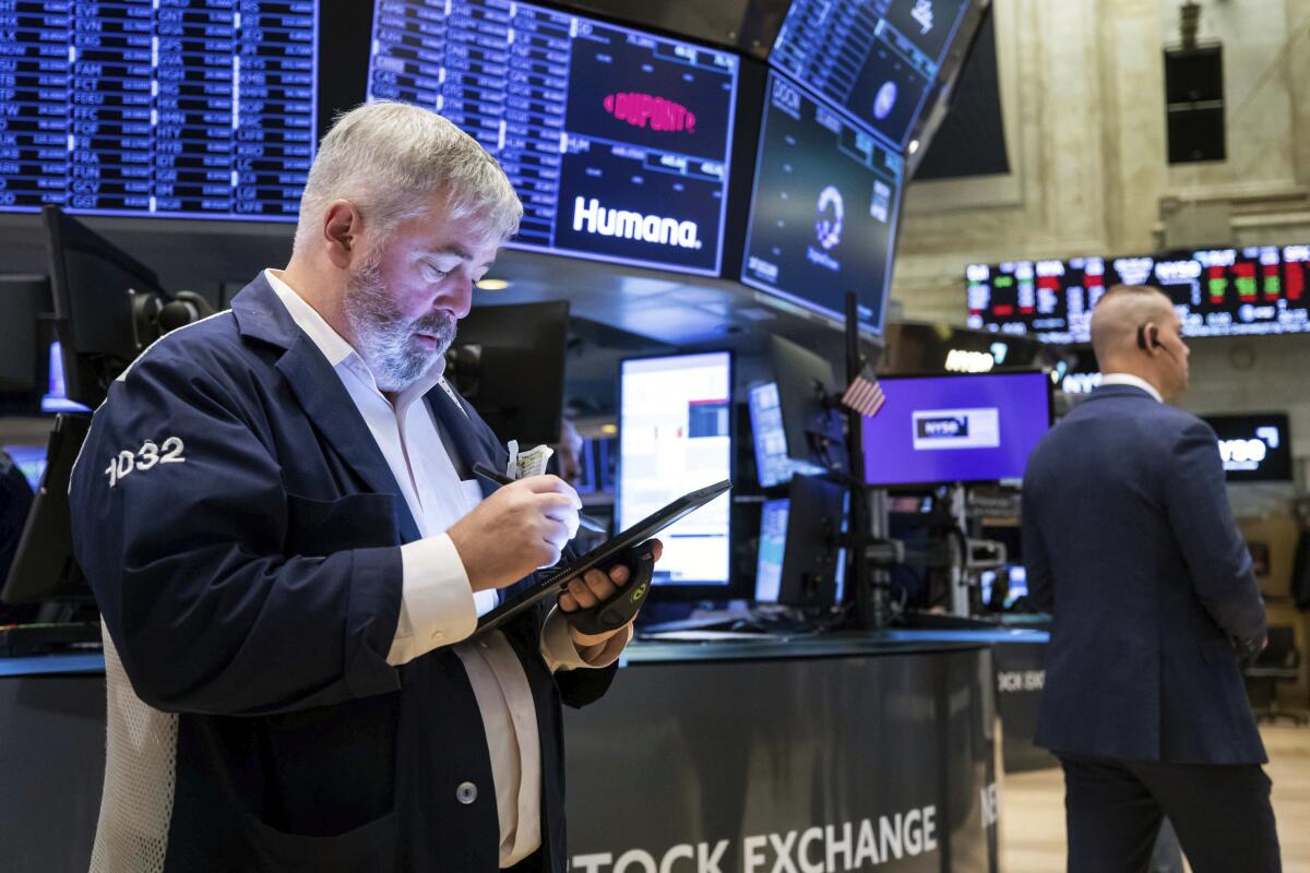 Two men on the floor of the New York Stock Exchange