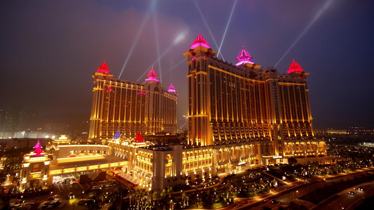 The Galaxy Macao, a dining, shopping, hotel and gambling center, is grandly illuminated at night. Air China is offering a $598 round-trip fare from LAX to the former Portuguese colony.