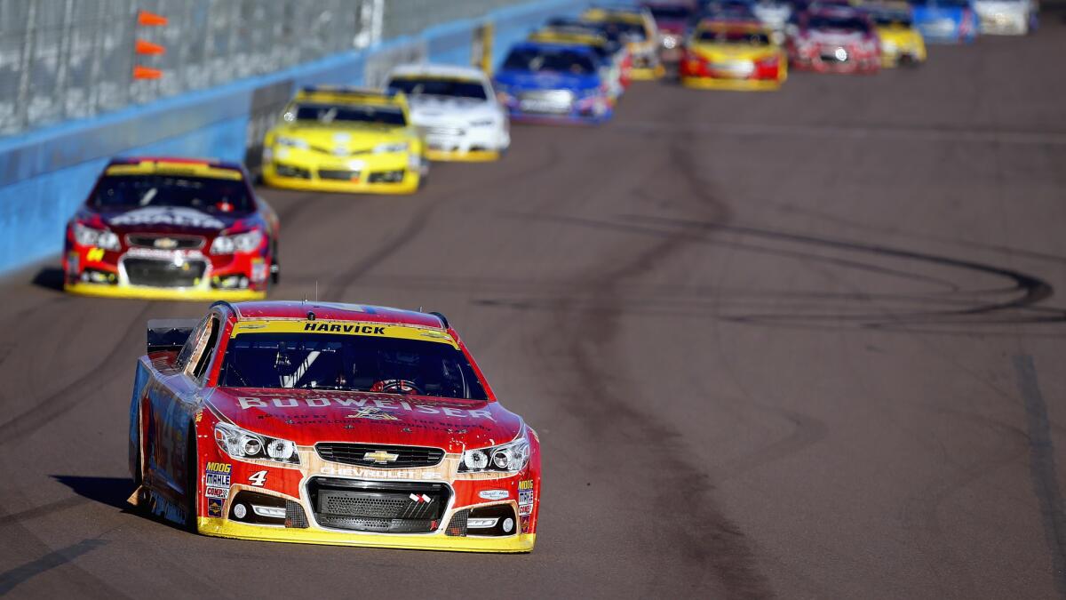 Kevin Harvick races at the front of the field during Sunday's NASCAR Sprint Cup race at Phoenix International Raceway.