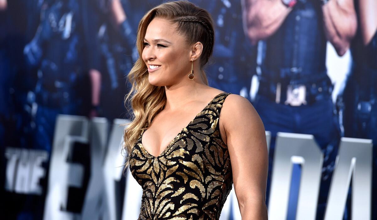 UFC bantamweight champion Ronda Rousey arrives for the premiere of "The Expendables 3" at TCL Chinese Theatre.