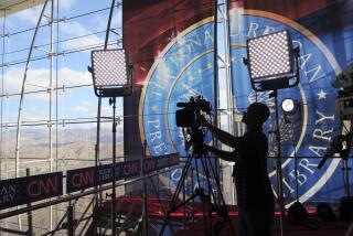 A technician adjusts a television camera before the start of the CNN Republican presidential debates at the Ronald Reagan Presidential Library and Museum Wednesday, Sept. 16, 2015 in Simi Valley, Calif. (AP Photo/Tom Stathis) ORG XMIT: CATS201
