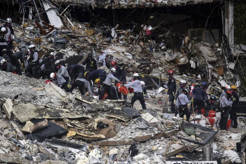 Search and rescue teams look for survivors at the Champlain Towers South residential condo, Tuesday, June 29, 2021, in Surfside, Fla. Many people were still unaccounted for after Thursday's fatal collapse. (Al Diaz /Miami Herald via AP)