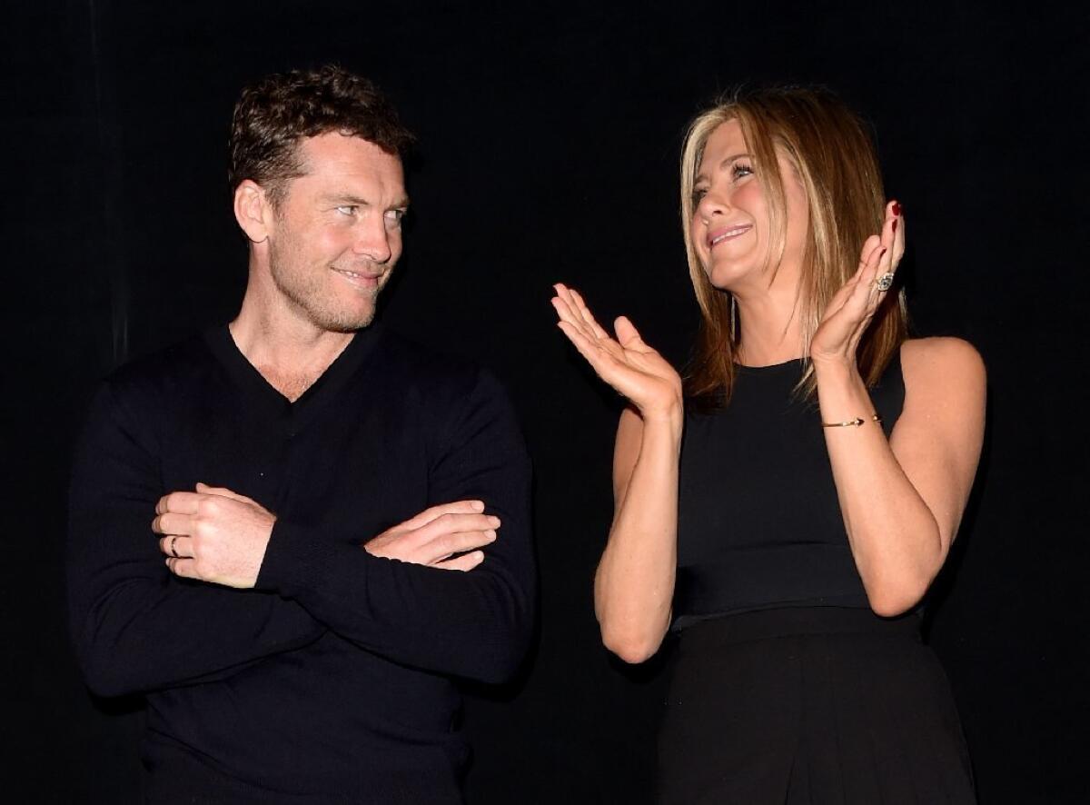 Sam Worthington and Jennifer Aniston onstage at the Toronto premiere of their new drama, "Cake."