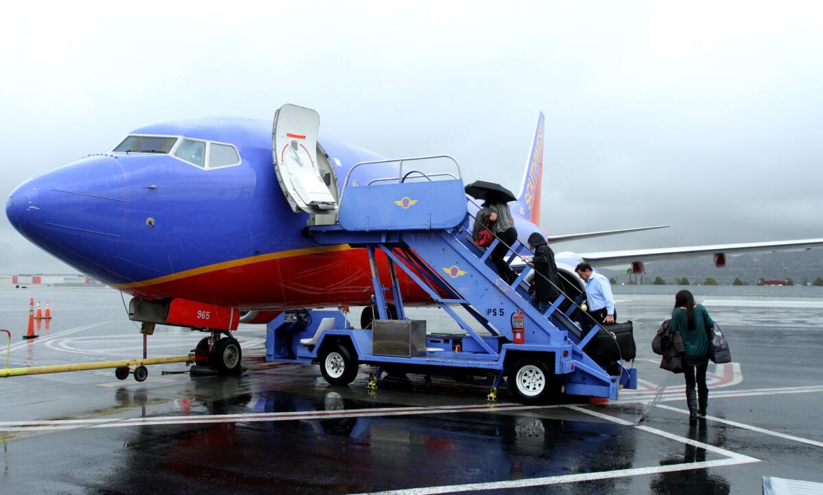 Passengers board the first Southwest Airlines Burbank-to-San Francisco flight out of Hollywood Burbank Airport on Wednesday, Jan. 6, 2016.