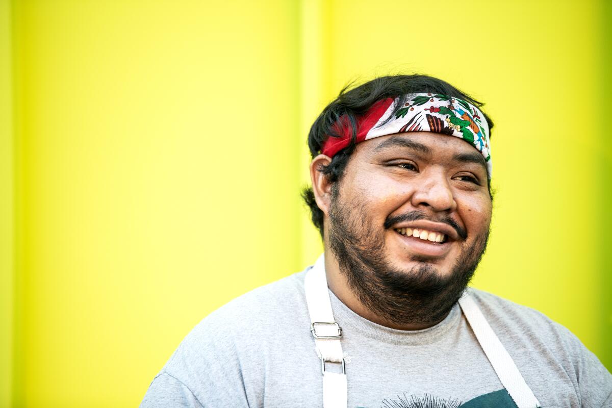Chef Rogelio Hernandez poses for a portrait at Grand Park in downtown Los Angeles.