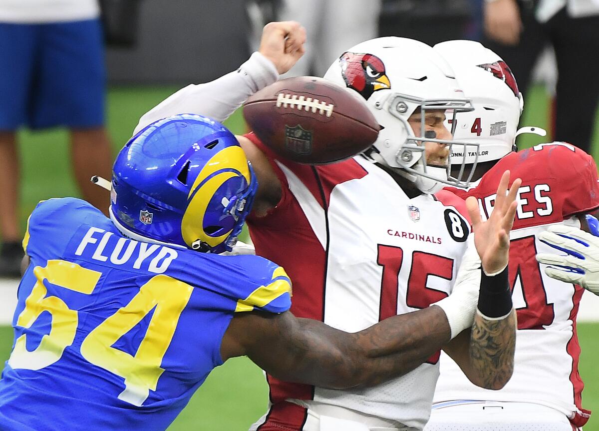 Rams linebacker Leonard Floyd forces Arizona Cardinals quarterback Chris Streveler to fumble during the second quarter.
