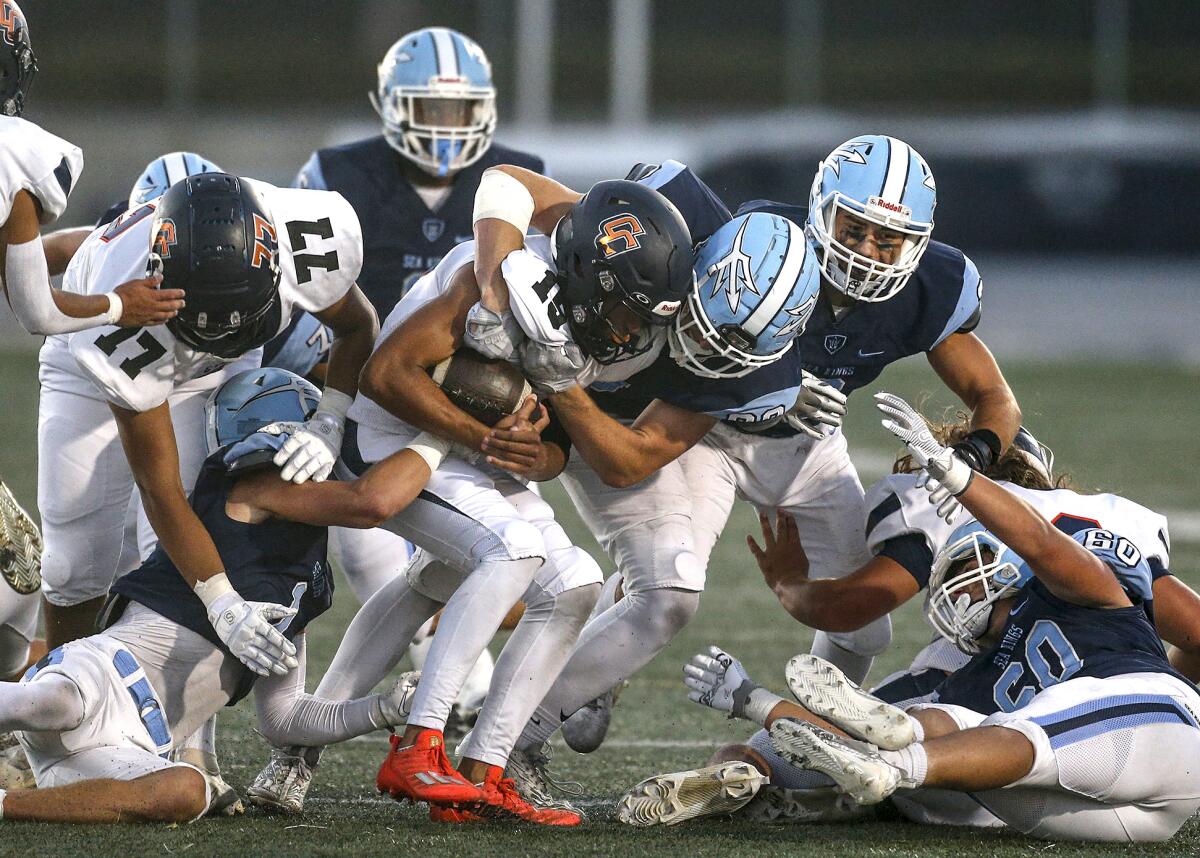 CdM linebacker Breck Clemmer (88) stops Cypress quarterback Aidan Houston at the line of scrimmage.