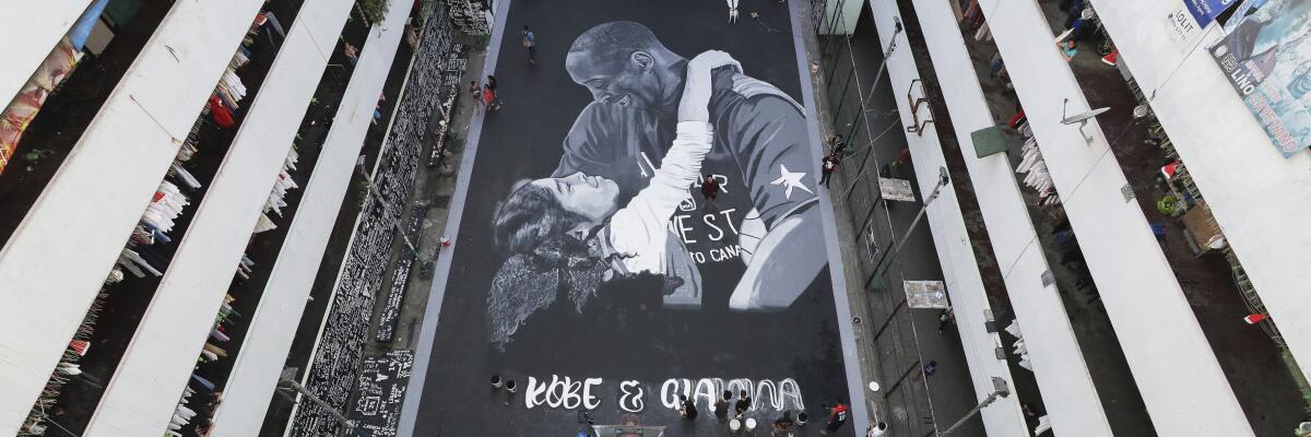 Artists put the finishing touches on a giant mural of Kobe and Gianna Bryant in Taguig, Philippines.