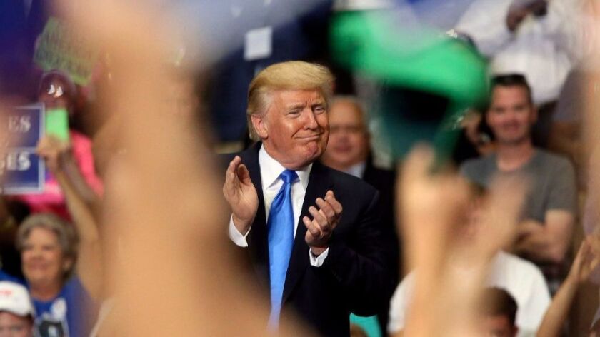 President Trump joins in the clapping Tuesday as he basks in applause at a "Make America Great Again" rally in Youngstown, Ohio.
