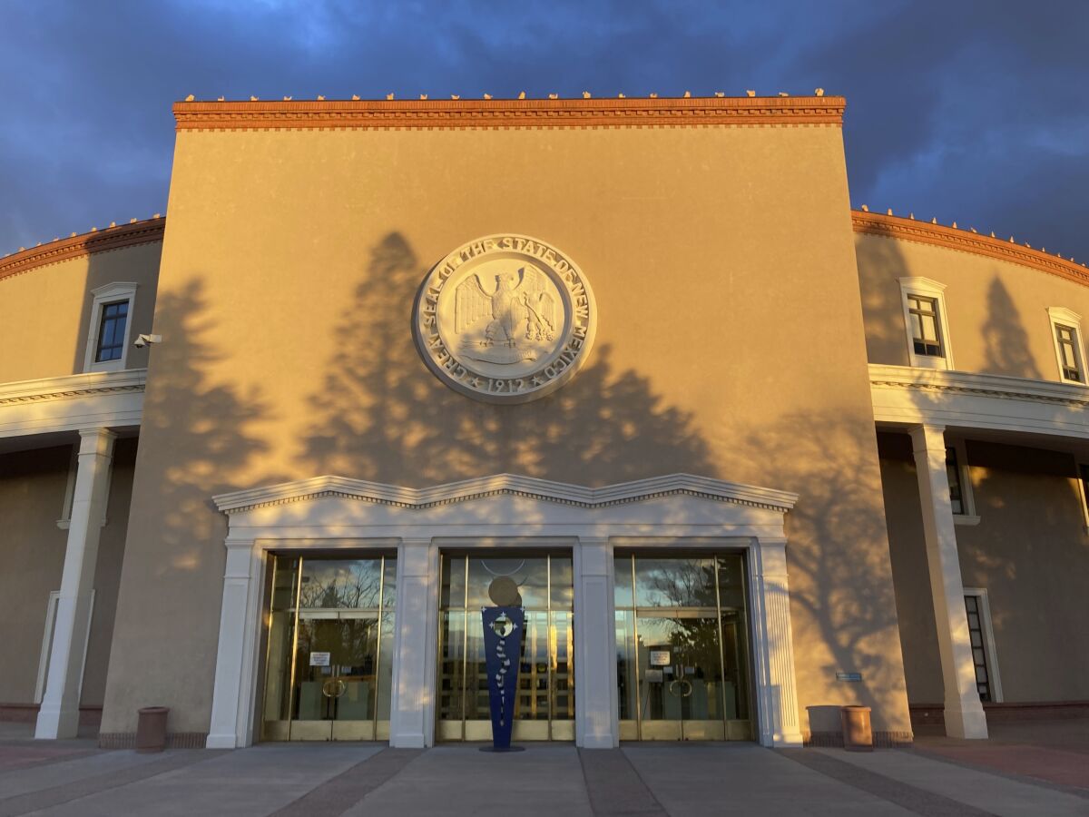 Afternoon sun shines on the New Mexico state Capitol building in Santa Fe, N.M., on Dec. 10, 2021. The state Legislature is scheduled to convene on Tuesday, Jan. 18, 2022, to consider critical decisions on spending, voting access, public education and criminal justice. (AP Photo/Morgan Lee)