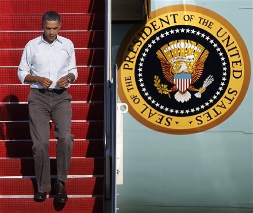 President Barack Obama jogs down the steps as he disembarks Air Force One upon arrival at Andrews Air Force Base, Md., Monday, Sept. 6, 2010. (AP Photo/Manuel Balce Ceneta)