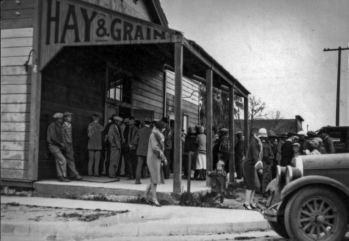 March 14. 1928: Crowds gather outside a temporary morgue set up for victims of the St. Francis Dam collapse.