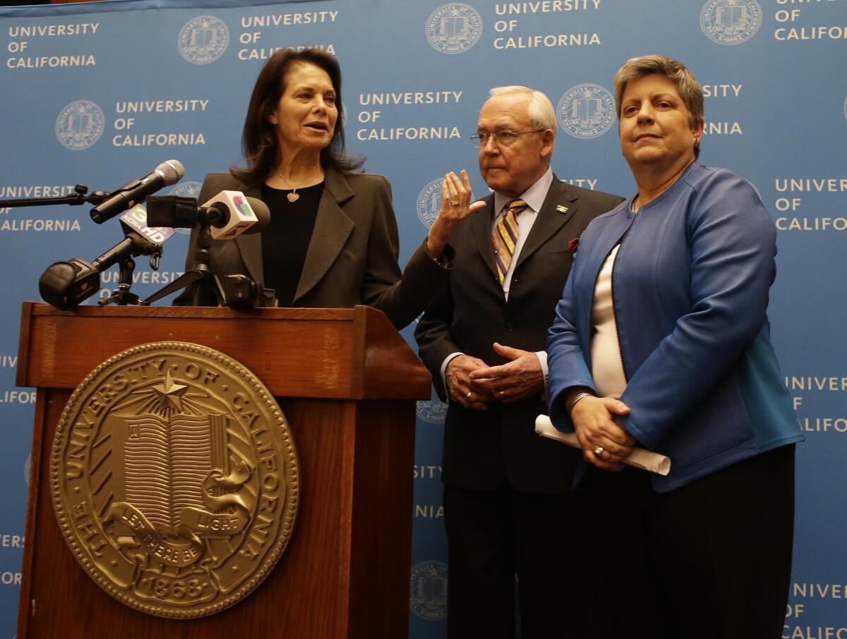 Janet Napolitano, right, is seen standing with University of California regents Sherry Lansing, left, and Bruce Varner, center, following a Board of Regents meeting in San Francisco.