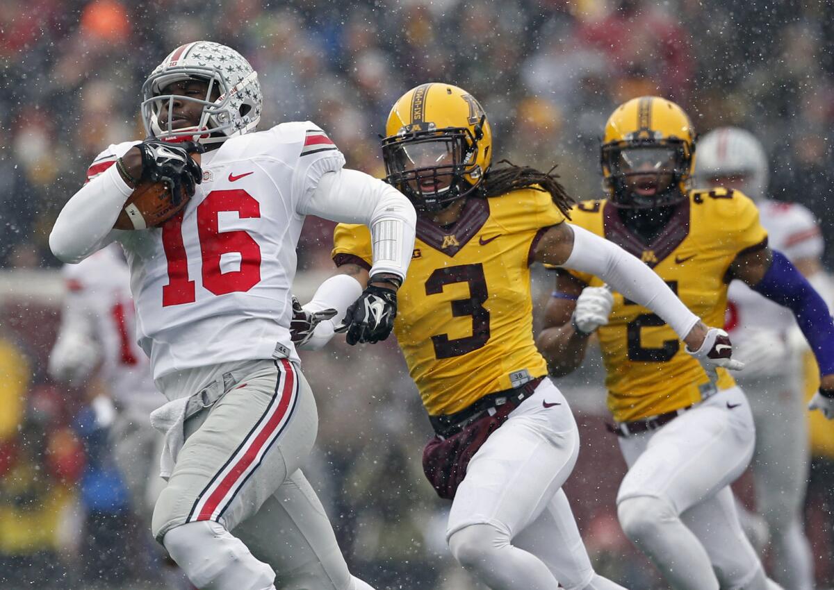 Ohio State quarterback J.T. Barrett runs for a touchdown against Minnesota on Nov. 15. The Buckeyes topped the Golden Gophers, 31-24.